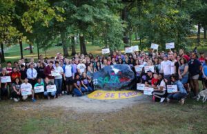 Supporters gather around the rock in unification. Photo by Jermaine Jackson.